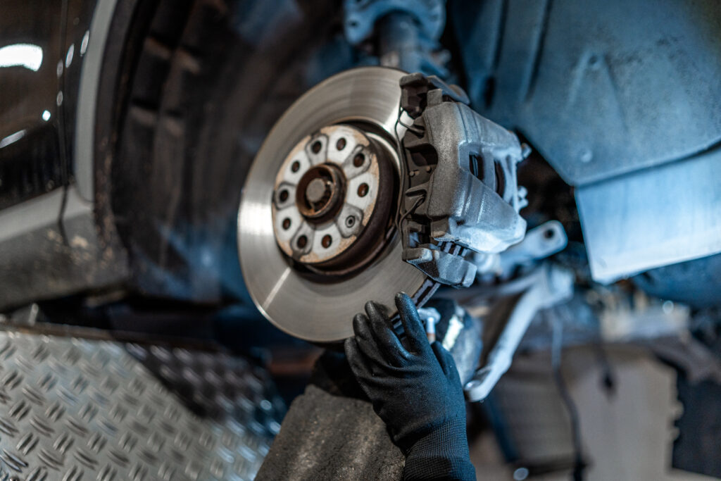 Brake repair service in Red Deer with mechanic replacing worn brake pads and ensuring vehicle safety