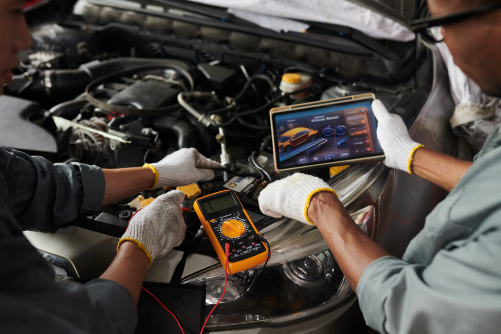 Mechanic performing engine diagnostics in Red Deer auto repair shop to identify vehicle issues